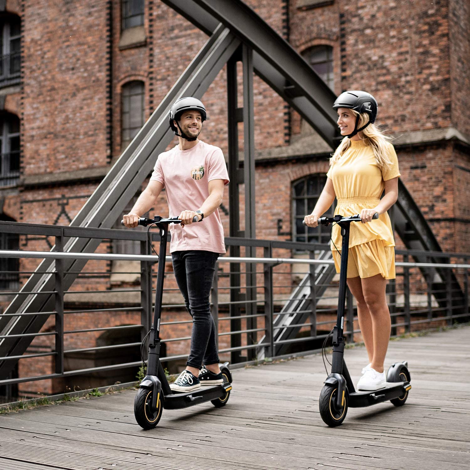 couple riding Segway Ninebot MAX Electric Kick Scooter