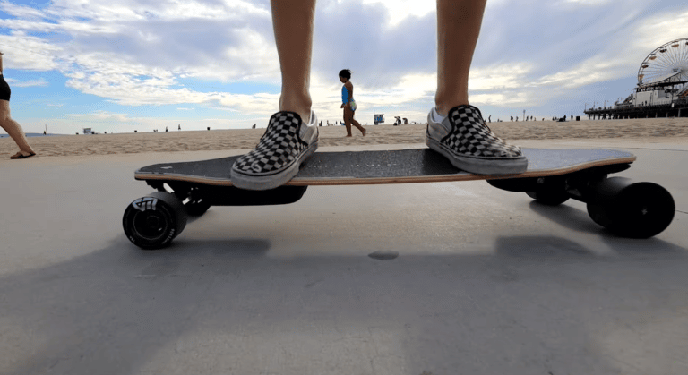 standing on an electric skateboard