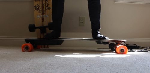 Person standing on Boosted Plus V3
