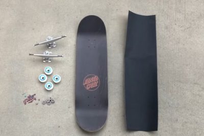 Putting trucks and grip tape on a skateboard