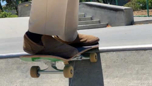 boy dropping in on a skateboard