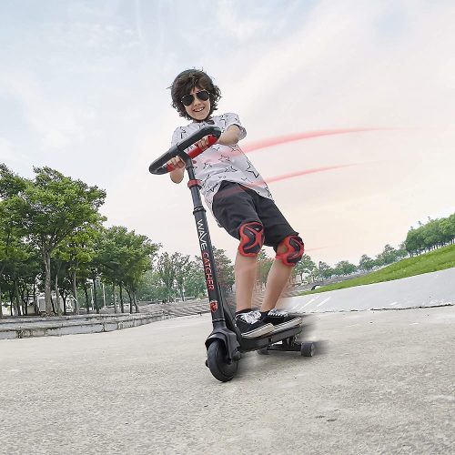 boy riding Wave Catcher three-wheel scooter