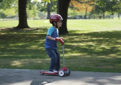 kid riding scooter